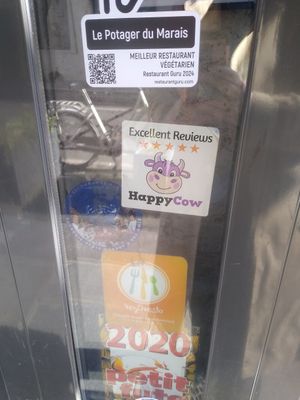 Happy Cow stickers on the door at Le Potager du Marais - Saint Paul in Paris