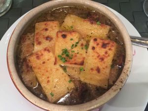 Best vegan French onion soup in the world. This photo does not do justice to this wonderful soup. The artisanal vegan cheese on top was amazing, the french bread in this soup was incredible and had more character than any of the french breads I've ever had in France, the onions are caramelized with a perfect texture allowing a wide variety of flavors to peak from the onions, the complex mix of spices and flavors in this were mind-blowing. I happened to take a non-veg co-worker to this wonderful restaurant and the look of shock on their face after trying this was priceless. They even admitted without me saying anything that this was the best soup they had ever had. Absolutely amazing. at Le Potager du Marais - Saint Paul in Paris