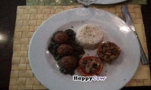 Lentil balls in spinage with some oven roasted tomato. This was the best vegan meal I've had EVER!!!!!!!!!! at Le Potager du Marais - Saint Paul in Paris