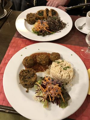 The meatballs à la Provençale (bottom) and the Roulé de Lupin à la Florentine (top). Similar plating and sides. Both dishes were delicious, the sides a bit bland. at Le Potager du Marais - Saint Paul in Paris