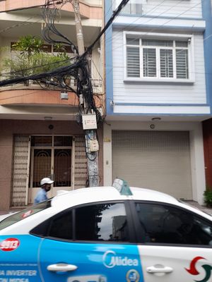 The vegan stall/  cart is opposite this building at Vegan Street Food Stall in Ho Chi Minh City