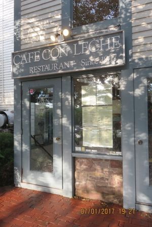 storefront from parking lot in back at Cafe Con Leche in Newtown
