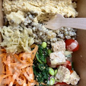Vegan buddha bowl with hummus, lentils, quinoa, edamame beans, tofu feta, vegetables and ferments    at The Cultured Deli in Bideford