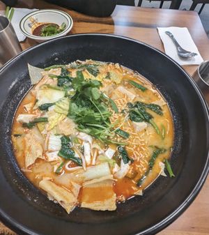 Spicy hot pot with tofu skin, tofu, ramen noodles, greens and mushrooms at Pixiu Mala Hongtang PDX in Portland