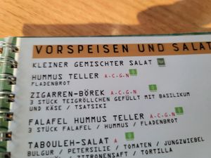 Part of the menu - it shows one item marked as Vegan and others marked as Veggie. at Cafe Merkur in Vienna