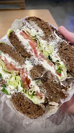 Pumpernickel everything bagel with scallion tofu vegan cream cheese,, added tomato and lettuce  at Bagel Boss in Burbank