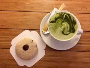 The popular vegan and gluten-free coconut-chocolate cookie & matcha soy latte. at Green Bear Coffee - La Canebiere in Marseille