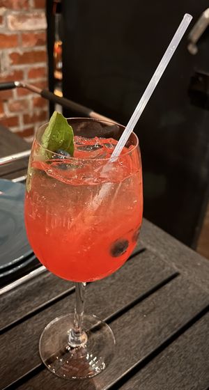 Delicious late-summer rose wine sangria, with watermelon, blueberry, basil leaf.  at Brewer's Fork in Charlestown