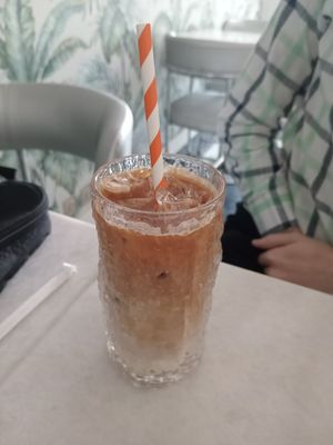 Iced latte with oat milk at Noon Bistro in Lahore