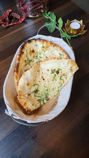 Garlic Naan - Freshly baked to order 'Infusion Naan' bread. Have them with drinks or as an able companion with your vegetarian or Vegan curry. at ROLA PAO in Warsaw