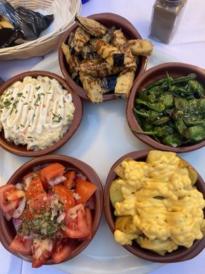 Vegan tapas with spicy potatoes, aubergine, tomatoes, some kind of potato salad and peppers    at Taberna La Malagueña in Malaga