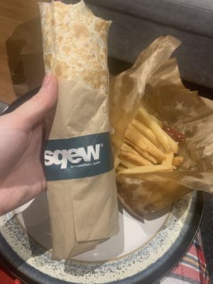 Falafel wrap with a portion of chips  at Sqew Shawarma Bar in Leeds