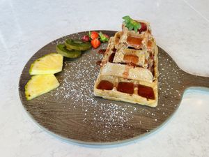 Waffle pyramid with strawberry jam 🍓   at Lemon Garden in Gothenburg