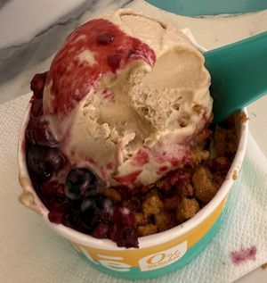 Peanut butter ice-cream on top, pistachio hiding at the bottom, caramelised biscuit crunch and a berry fruit coulis - it’s still settling as I write!  at Yole in Valletta