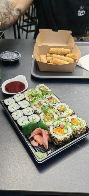Mix of vegan Hosomaki and Uramaki rolls with soy sauce at Ginger Sushi in Zagreb