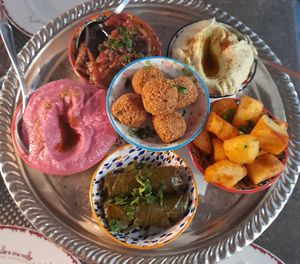 Falafel, potatoes with harissa, mussaka, vine rolls, mint hummus, beetroot hummus at Le Mille e Una Notte in Trieste