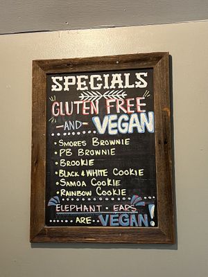 two signs in the store specifying the vegan options   at Crust & Crumb Bakery in Beach Haven