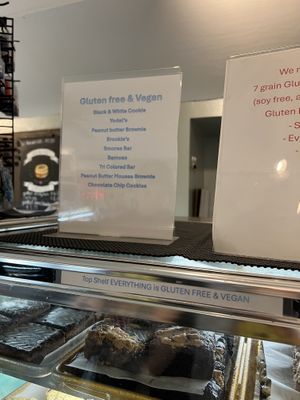 the sign to the right is specifying that they have 7 GF/V bagel options   at Crust & Crumb Bakery in Beach Haven