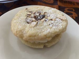 The almond croissant sandwich cookie   at Sweet Haven Bakery in Citrus Heights