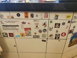 Stickers at the bar at La Mandragora in Valencia