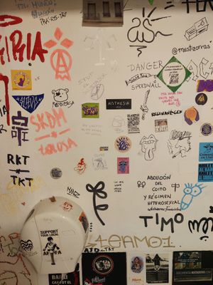 Stickers on the bathroom at La Mandragora in Valencia