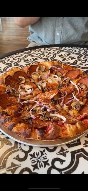 AMAZING pizza!! Both the regular and gf (cauliflower) crust are vegan. They also have vegan mozzarella, pepperoni, and chorizo, in addition to endless vegetable toppings.  at Bliss Beach in Daytona Beach Shores