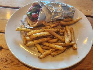 Veggie Kalamaki pita wrap and fries at Kalamaki Greek Eatery in Anna