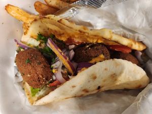 Falafel Kalamaki pita wrap and fries at Kalamaki Greek Eatery in Anna