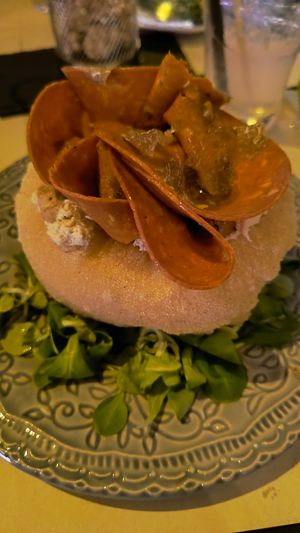 Pizzottella con mortadella vegana, brie vegano, tartufo e granella di pistacchio. at Magnebevo e sto a Ostiense in Rome