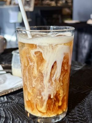 Iced Earl Grey Oatmilk Tea with Bourbon Caramel (vegan)  at Coquelicot Gallery and Cafe in Palatine