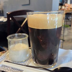 Iced earl Grey oatmilk tea with bourbon caramel at Coquelicot Gallery and Cafe in Palatine