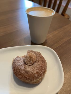 Cinnamon donut & oat latte  at Queen City Collective Coffee - Santa Fe Dr in Denver