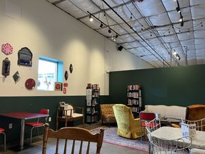 Half of the indoor seating  at Queen City Collective Coffee - Santa Fe Dr in Denver