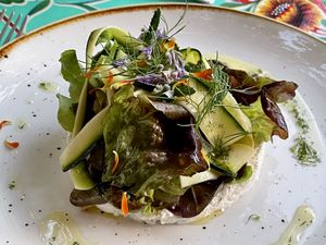 Our almond ricotta al Pesteda (mixture of herbs and pepper from Valtellina) with leaves, aromatic herbs, flowers, marinated courgettes and chopped fennel and lemon zest  at La Cena di Pitagora in Ponte Nizza