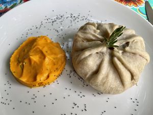 Skartos: baked bundle stuffed with vegetables with carrot and chive sauce  at La Cena di Pitagora in Ponte Nizza