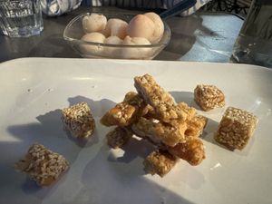 Vegan desserts: Vietnamese nougat (vegan, no honey) and lychees.  at Croq' Nem Le Tai in Avignon