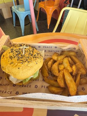 Funny Crispy Chic sandwich and yummy potato wedges  at Flower Burger in Pescara