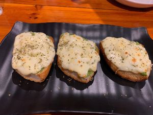Bruschetta al Sappori di Pesto…. Vegetarian…. Bread garlic, olive oil, pesto, mozzarella cheese, olive oil, oregano at HoiAnPizza in Hoi An