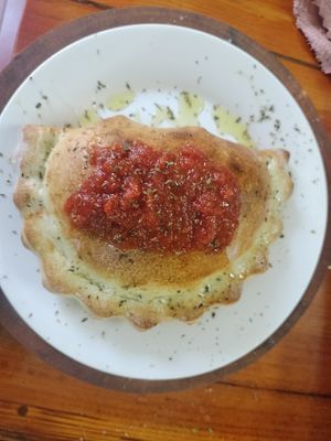 Vegetarian Calzone…Mushrooms, Bell Peppers, Onions, mozzarella cheese, topped with Chef Long’s Pomodoro sauce & herbs. outstanding!!! at HoiAnPizza in Hoi An
