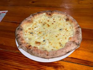 QUATTRO FORMAGGI ~ FOUR CHEESE PIZZA. AN OUTSTANDING PIZZA LOADED WITH IMPORTED CHEESES, HAND BLENDED WHEN WE MAKE IT FRESH!! NO RED SAUCE
ENJOY!! at HoiAnPizza in Hoi An