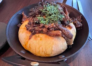 Koji flatbread with chilli ragu and smoked mushroom at Holy Carrot in West London