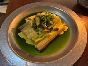 Coal roasted leeks with almond romesco at Holy Carrot in West London