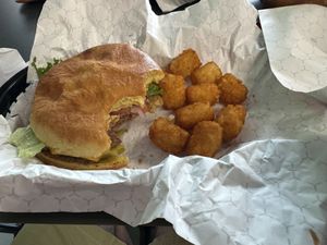 Bbq bacon burger and tater tot's  at Romeo's in Asheville