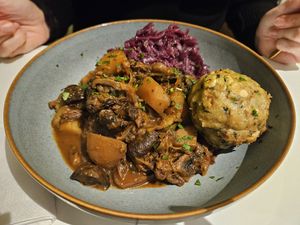 Smoky mushroom and potato goulash with fruity red cabbage & dumpling at Sannie in Ratingen