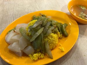 Turmeric rice with steamed radish, stir fried celery and bittergourd at Kwan Inn Vegetarian 观音斋 - Chinatown in Central Singapore