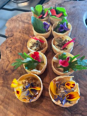 mini amuse-bouche with wild herbs and flowers at Pikniq in Stropino