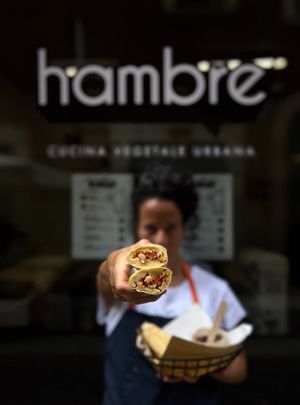 POP-LENTA - polenta stuffed with beans and vegetables, steamed in a corn leaf
+ SOUTEED VEGETABLE + sour sauce
 at Hambre Street Food in Verona