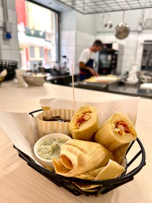 POP-LENTA - polenta stuffed with beans and vegetables, steamed in a corn leaf
+ SOUTEED VEGETABLE + sour sauce at Hambre Street Food in Verona