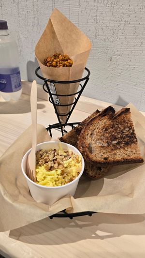 Panino integrale con kimchi di cavolo, scamorza vegetale, insalatina + cono di ceci croccanti speziati at Hambre Street Food in Verona