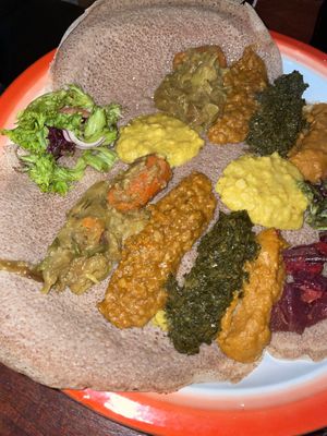 Mixed plate with lentils, spinach, potatoes, chickpeas and more  at African Pearl in Frankfurt
